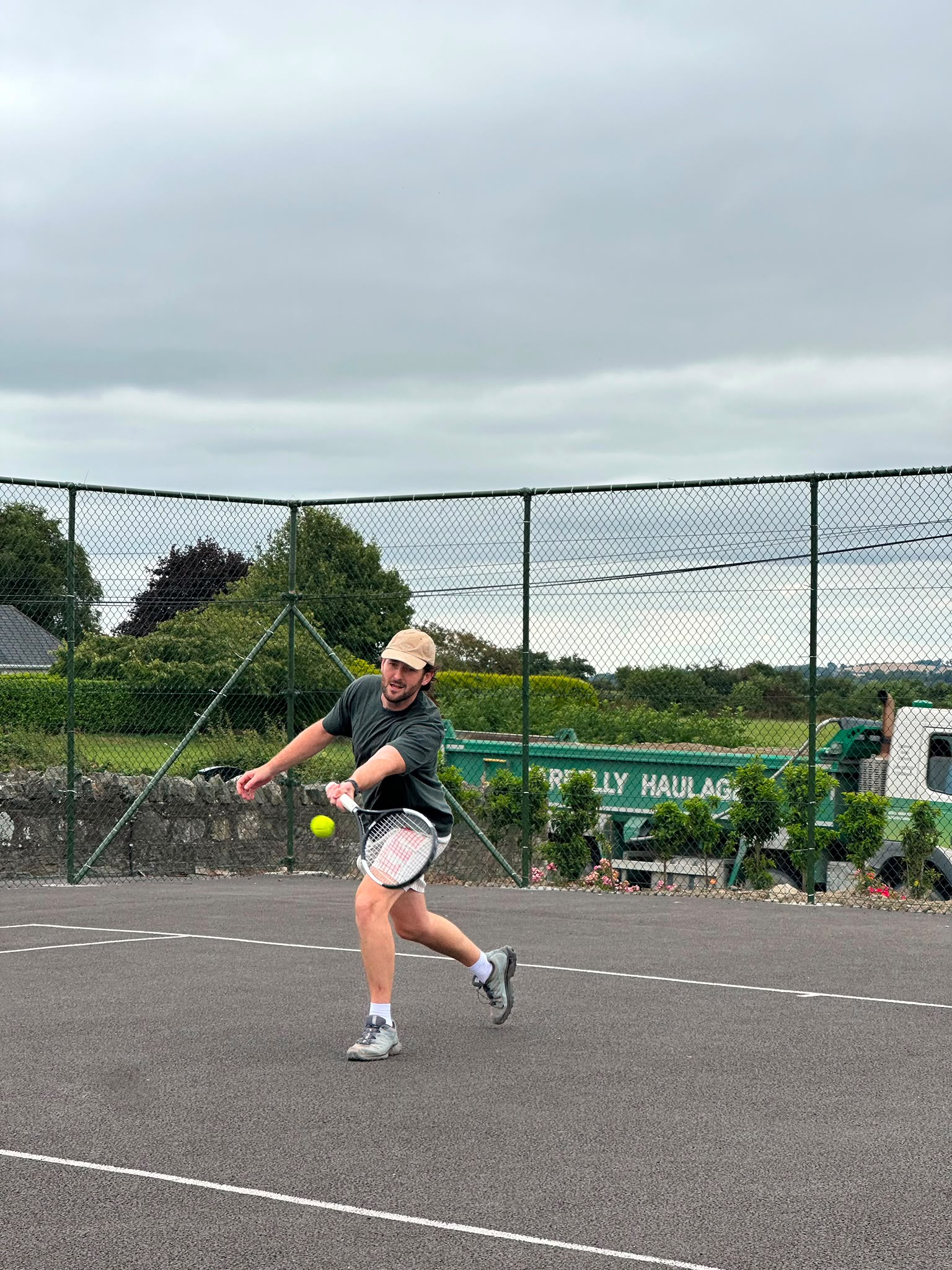 An adult member playing a forehand