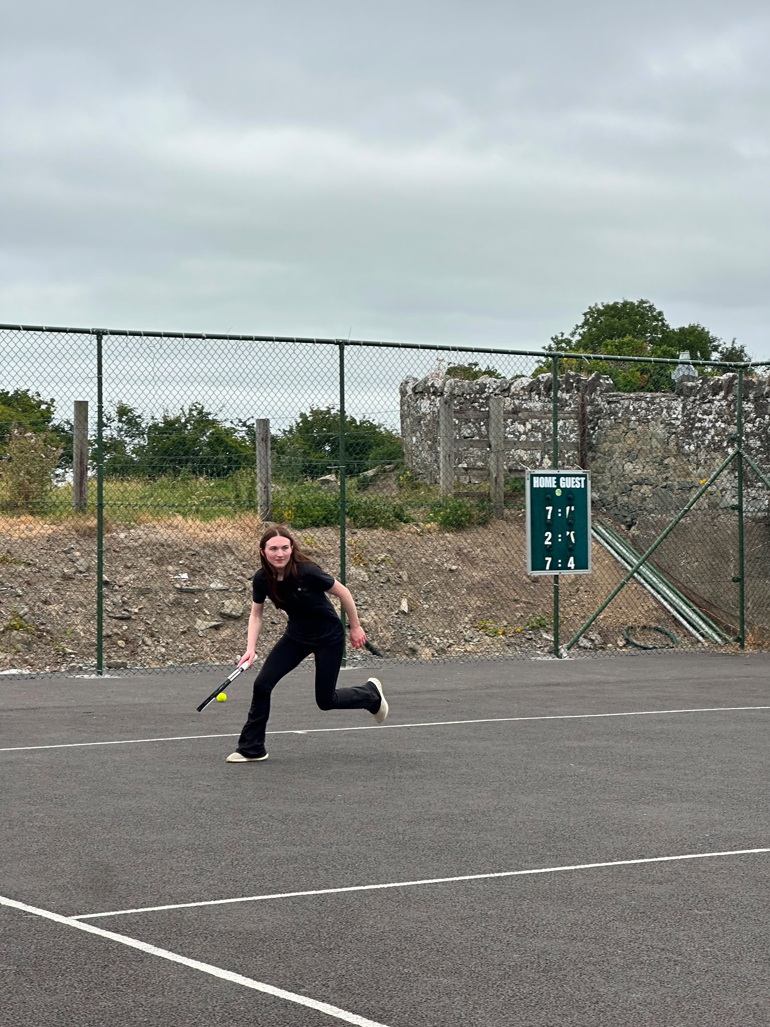 A member chasing down a ball during a match